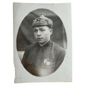 Red Army soldier with badges and Budyonovka hat