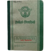 WW2 original Polizei-Dienstpaß. Bandenkampfabzeichen awarding.