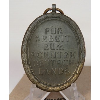 Deutsches Schutzwall Medaille. C. Poellath in the bag.. Espenlaub militaria