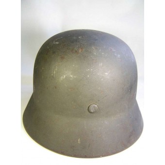 M 35 , Q 64 helmet, post 1940 year reissue, battle damaged !. Espenlaub militaria